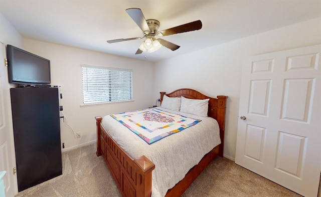 33491 Rd 233, North Fork, CA 93643 - bedroom featuring light colored carpet, baseboards, and a ceiling fan