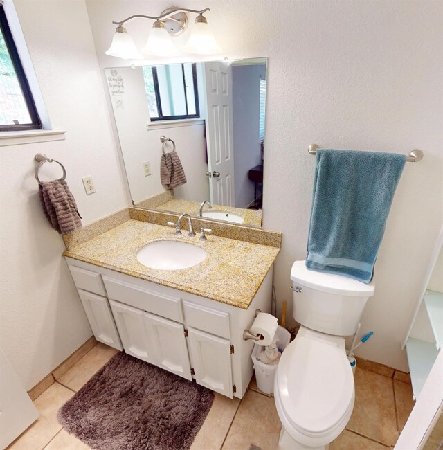 33491 Rd 233, North Fork, CA 93643 - bathroom featuring vanity, plenty of natural light, toilet, and tile patterned flooring