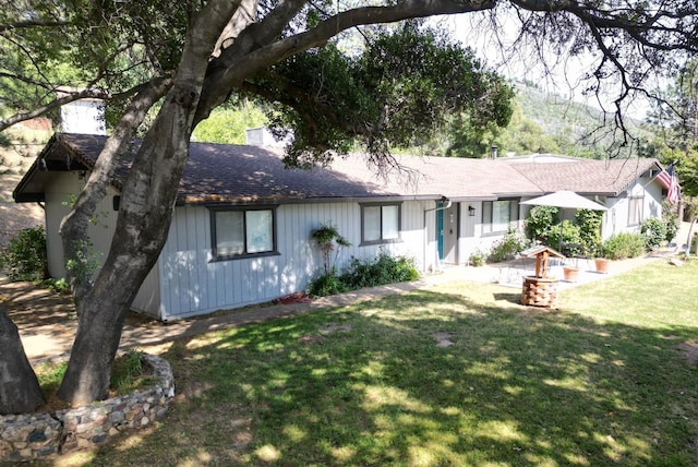 33491 Rd 233, North Fork, CA 93643 - ranch-style house featuring a front yard, a shingled roof, and a chimney
