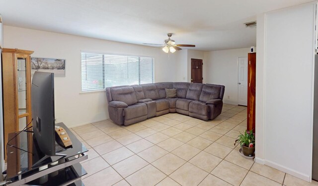 33491 Rd 233, North Fork, CA 93643 - living room featuring ceiling fan, light tile patterned flooring, and baseboards