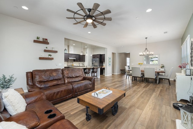 3771 Wrenwood Ave, Clovis, CA 93619 - living room with a ceiling fan, light wood-style floors, a chandelier, recessed lighting, and baseboards
