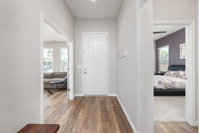 3771 Wrenwood Ave, Clovis, CA 93619 - foyer featuring wood finished floors, a textured wall, and baseboards