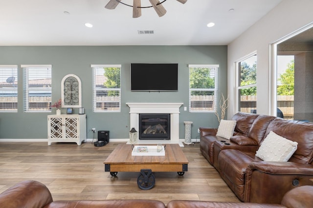 3771 Wrenwood Ave, Clovis, CA 93619 - living room with wood finished floors, ceiling fan, healthy amount of natural light, recessed lighting, and baseboards