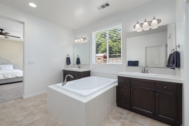3771 Wrenwood Ave, Clovis, CA 93619 - bathroom with a garden tub, two vanities, ensuite bath, and a ceiling fan