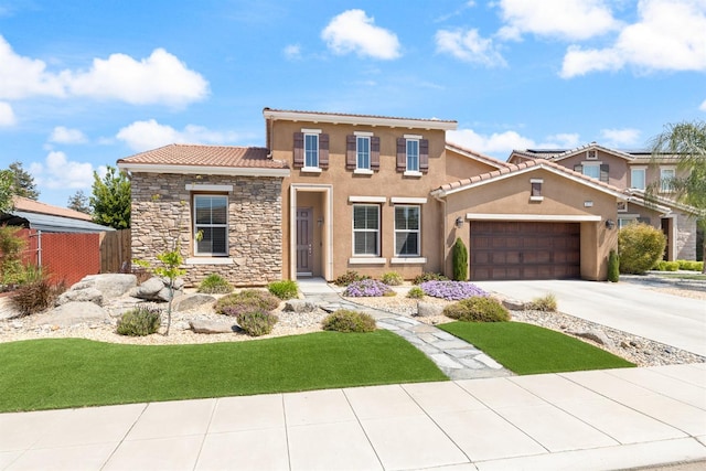 3771 Wrenwood Ave, Clovis, CA 93619 - mediterranean / spanish-style house featuring a tiled roof, a garage, stucco siding, and driveway