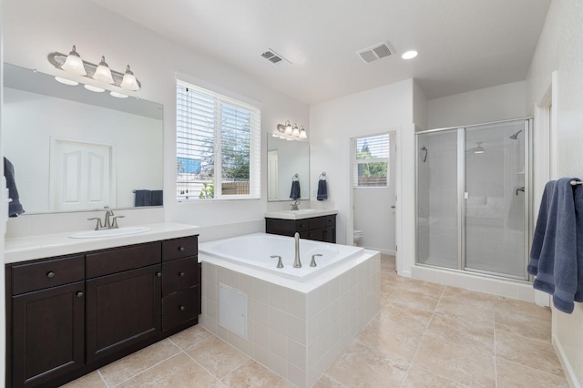 3771 Wrenwood Ave, Clovis, CA 93619 - bathroom featuring a shower stall, two vanities, a bath, toilet, and tile patterned floors
