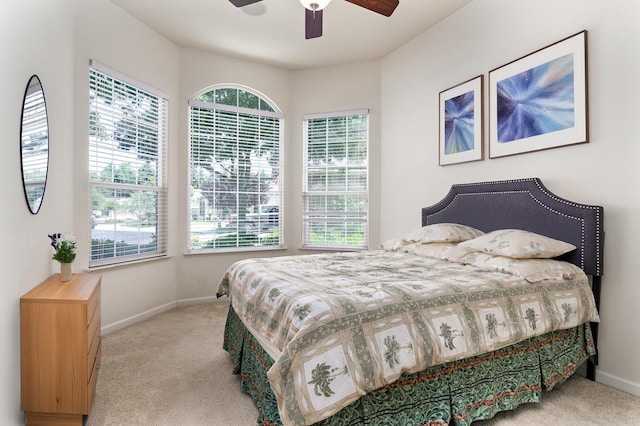 1413 N Hornet Ave, Clovis, CA 93619 - carpeted bedroom featuring multiple windows, baseboards, and ceiling fan