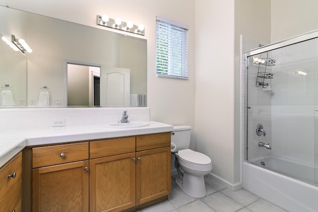 1413 N Hornet Ave, Clovis, CA 93619 - full bath with vanity, toilet, tile patterned flooring, enclosed tub / shower combo, and baseboards