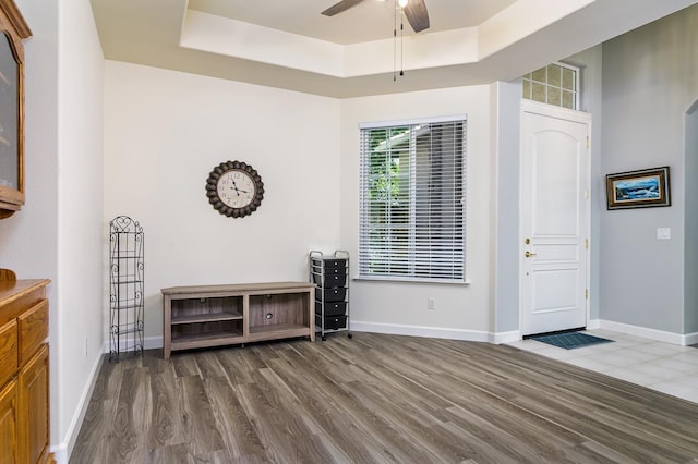 1413 N Hornet Ave, Clovis, CA 93619 - foyer entrance featuring wood finished floors, a raised ceiling, ceiling fan, and baseboards