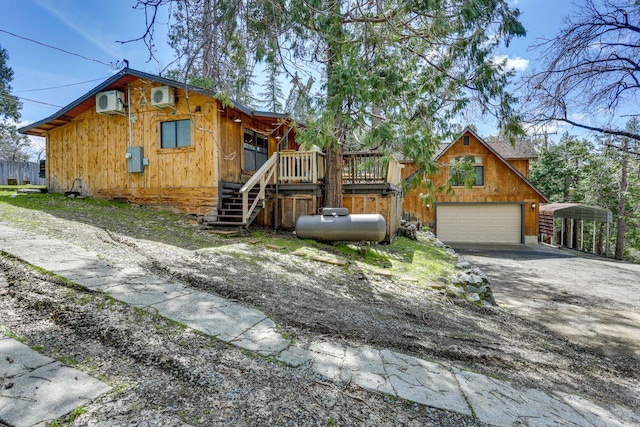 35859 Rd 222, Wishon, CA 93669 - view of front of home featuring concrete driveway, stairs, a carport, and a deck