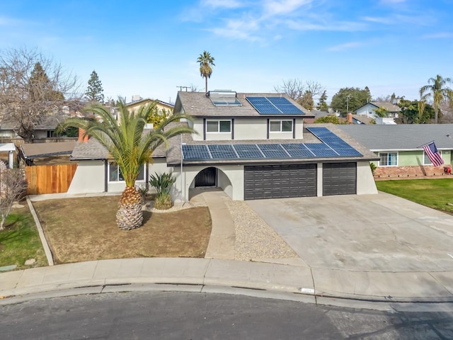 829 Polson Ave, Clovis, CA 93612 - view of front of property with stucco siding, roof mounted solar panels, driveway, a garage, and a tile roof