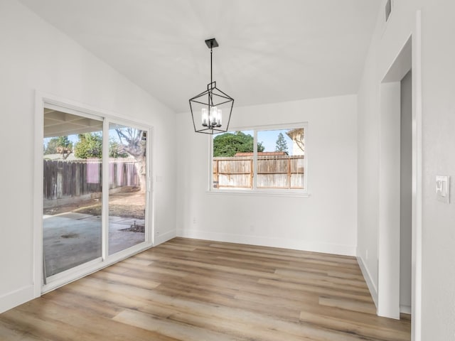 829 Polson Ave, Clovis, CA 93612 - empty room featuring a chandelier, baseboards, and light wood-type flooring