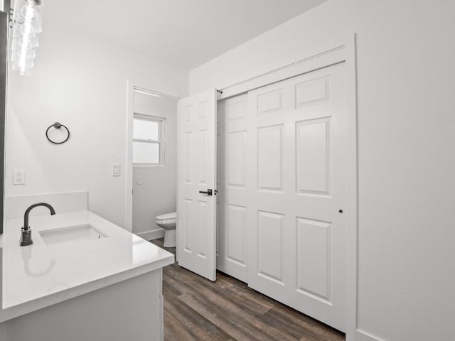 829 Polson Ave, Clovis, CA 93612 - bathroom featuring toilet, vanity, and wood finished floors