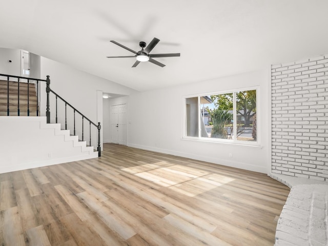 829 Polson Ave, Clovis, CA 93612 - unfurnished living room featuring light wood-style floors, ceiling fan, stairs, baseboards, and vaulted ceiling