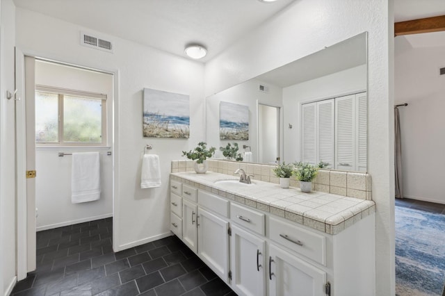 3244 W Fremont Ave, Fresno, CA 93711 - bathroom featuring vanity, tile patterned floors, and baseboards