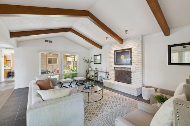 3244 W Fremont Ave, Fresno, CA 93711 - living room featuring a brick fireplace and dark tile patterned floors