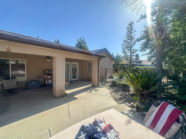 3055 Glenville Ave, Madera, CA 93637 - back of property with stucco siding, a ceiling fan, and a patio