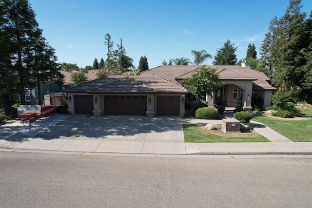 3055 Glenville Ave, Madera, CA 93637 - single story home with an attached garage, a tile roof, driveway, a chimney, and stucco siding