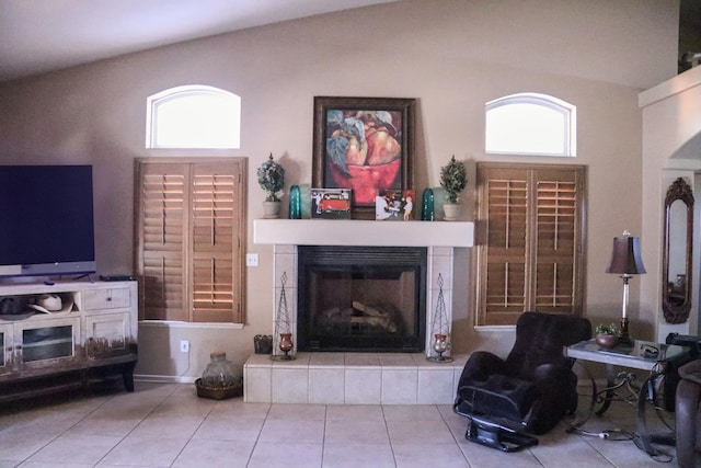 3055 Glenville Ave, Madera, CA 93637 - living area featuring a fireplace, tile patterned flooring, plenty of natural light, and vaulted ceiling
