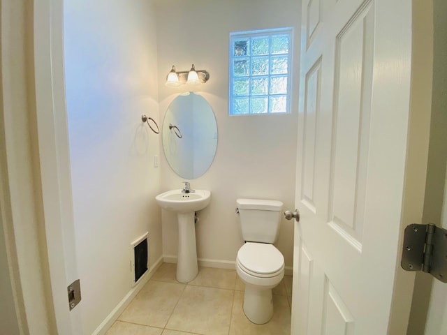 1507 N Strada Way, Clovis, CA 93619 - bathroom with toilet, tile patterned flooring, a sink, and baseboards