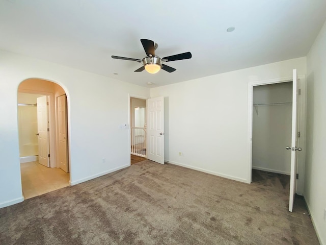 1507 N Strada Way, Clovis, CA 93619 - unfurnished bedroom featuring carpet, arched walkways, baseboards, and a closet