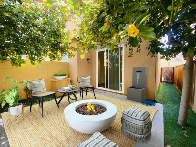 1507 N Strada Way, Clovis, CA 93619 - fenced backyard featuring an outdoor fire pit and a patio area