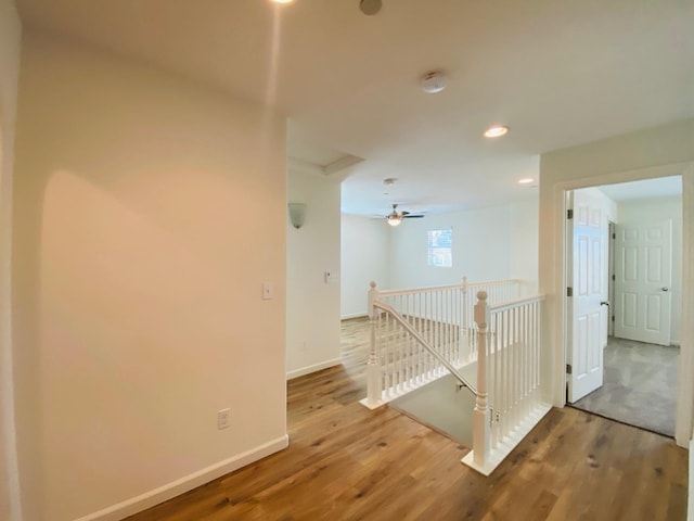 1507 N Strada Way, Clovis, CA 93619 - corridor with an upstairs landing, wood finished floors, baseboards, and recessed lighting