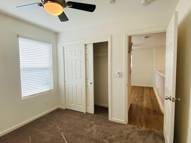 1507 N Strada Way, Clovis, CA 93619 - unfurnished bedroom featuring dark carpet, a closet, baseboards, and ceiling fan
