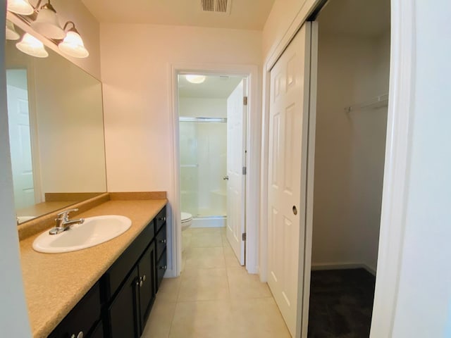 1507 N Strada Way, Clovis, CA 93619 - full bath featuring a shower with door, vanity, toilet, and tile patterned flooring
