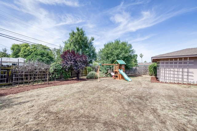 136 E Simpson Ave, Fresno, CA 93704 - fenced backyard with a playground
