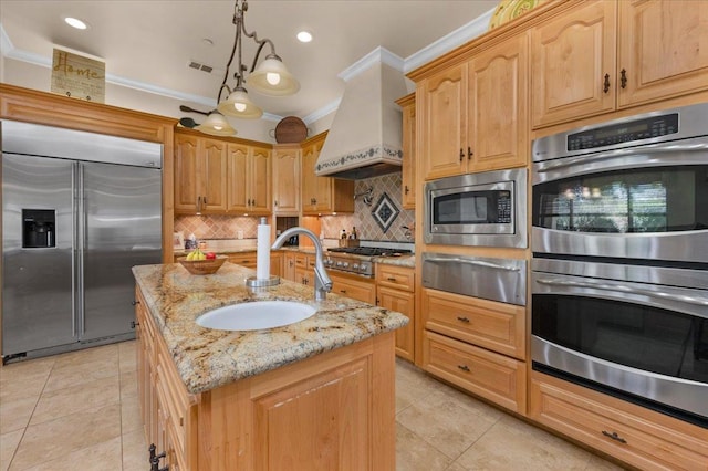 2707 W Menlo Ave, Fresno, CA 93711 - kitchen with built in appliances, a warming drawer, premium range hood, ornamental molding, and light tile patterned floors
