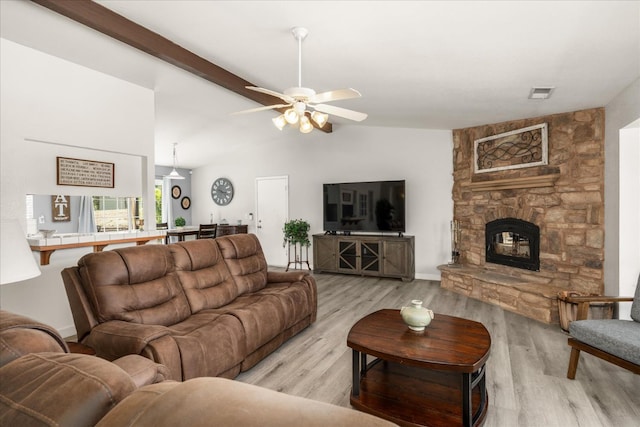 30015 Stetson Dr, Coarsegold, CA 93614 - living area featuring vaulted ceiling, a stone fireplace, light wood-style floors, and ceiling fan