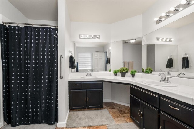 30015 Stetson Dr, Coarsegold, CA 93614 - full bathroom featuring double vanity, a shower with shower curtain, and baseboards
