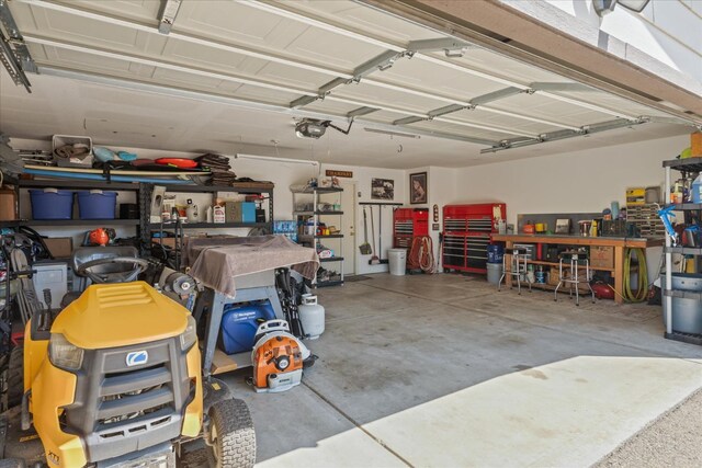 30015 Stetson Dr, Coarsegold, CA 93614 - garage featuring a workshop area and a garage door opener