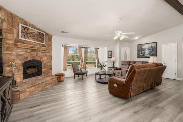 30015 Stetson Dr, Coarsegold, CA 93614 - living area with a fireplace, vaulted ceiling, light wood-style floors, and a ceiling fan