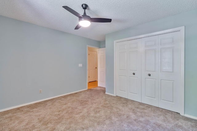 4633 N Glenn Ave, Fresno, CA 93704 - unfurnished bedroom featuring carpet floors, baseboards, a closet, a ceiling fan, and a textured ceiling