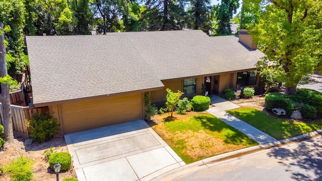4633 N Glenn Ave, Fresno, CA 93704 - view of front of property featuring a shingled roof, an attached garage, driveway, and a front lawn