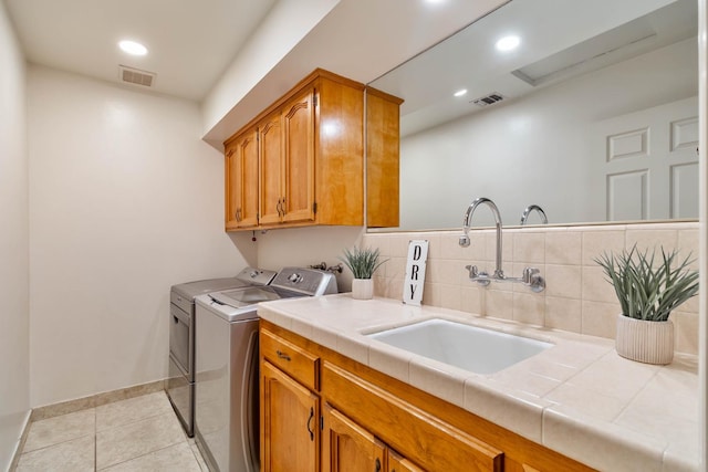 4633 N Glenn Ave, Fresno, CA 93704 - laundry area featuring a sink, washer and dryer, light tile patterned floors, baseboards, and recessed lighting