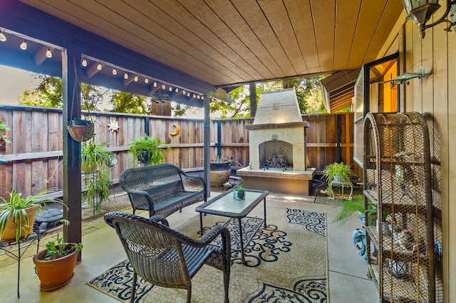 4633 N Glenn Ave, Fresno, CA 93704 - sunroom with an outdoor living space with a fireplace
