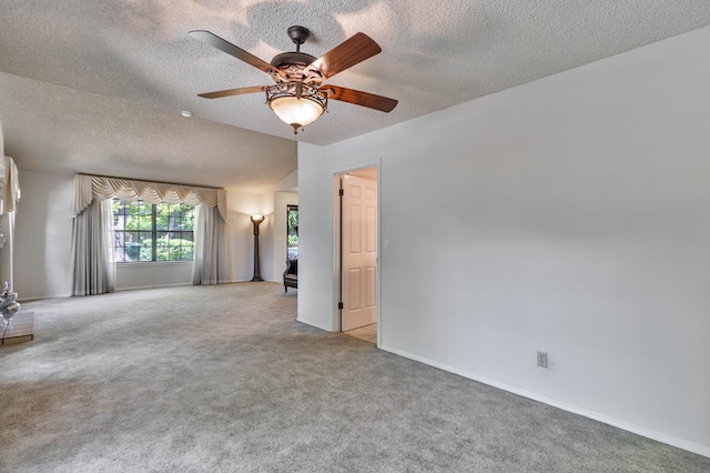 4633 N Glenn Ave, Fresno, CA 93704 - spare room with carpet flooring, a textured ceiling, ceiling fan, and baseboards