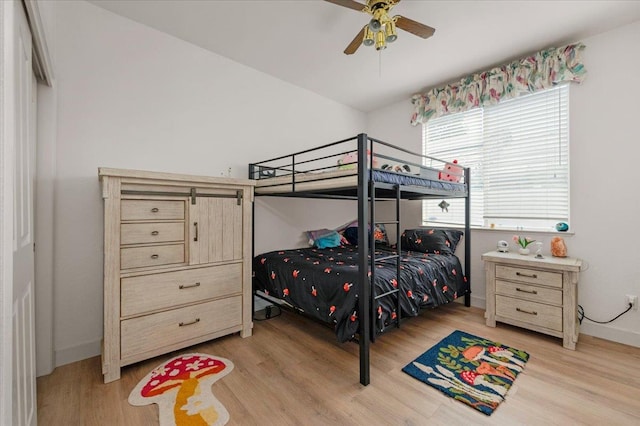 2162 Decatur Ave, Clovis, CA 93611 - bedroom with light wood-type flooring, baseboards, and a ceiling fan