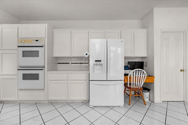 2162 Decatur Ave, Clovis, CA 93611 - kitchen featuring white appliances, tile counters, white cabinetry, and light tile patterned floors