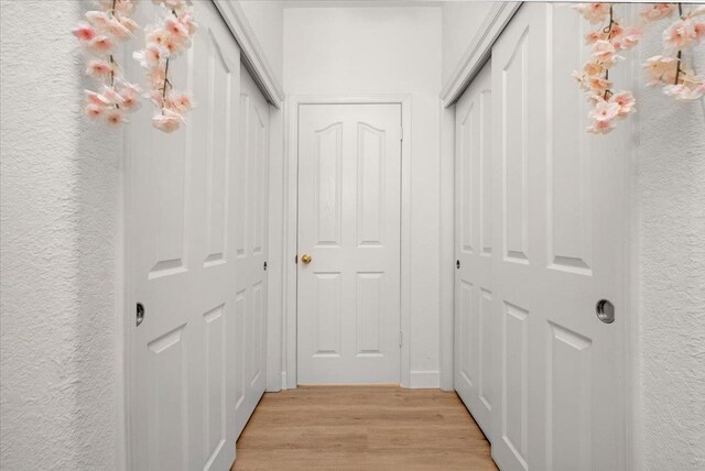 2162 Decatur Ave, Clovis, CA 93611 - hall with light wood-style flooring and a textured wall