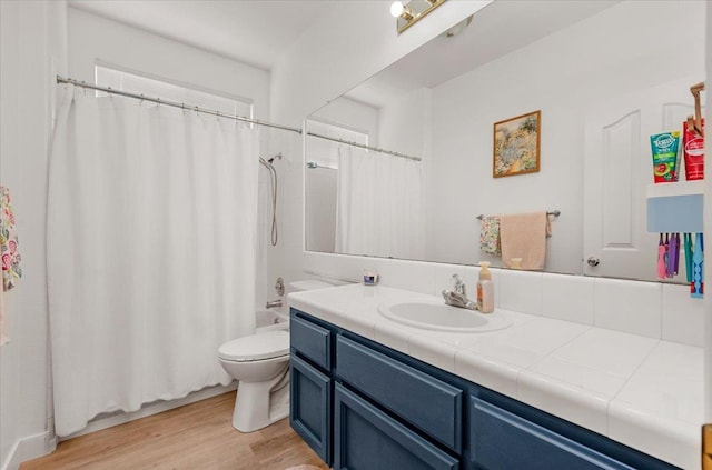 2162 Decatur Ave, Clovis, CA 93611 - full bath featuring vanity, toilet, wood finished floors, and shower / tub combo