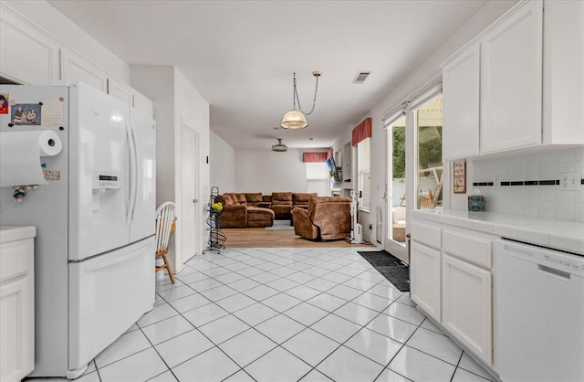 2162 Decatur Ave, Clovis, CA 93611 - kitchen featuring white appliances, tile counters, white cabinetry, open floor plan, and light tile patterned floors