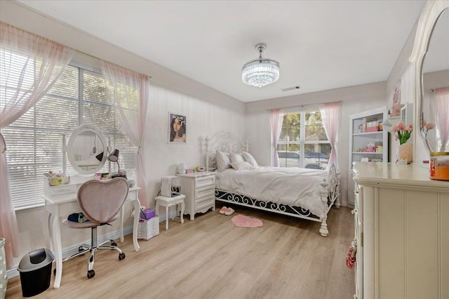 2162 Decatur Ave, Clovis, CA 93611 - bedroom featuring light wood-style flooring, a chandelier, and baseboards