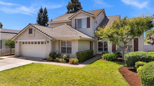 2162 Decatur Ave, Clovis, CA 93611 - view of front of home with an attached garage, a tiled roof, concrete driveway, and stucco siding