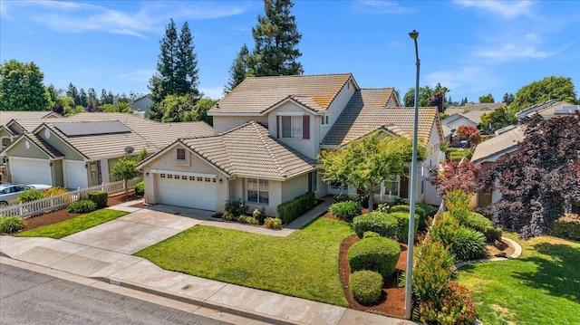 2162 Decatur Ave, Clovis, CA 93611 - view of front of property featuring a tile roof, an attached garage, driveway, stucco siding, and a residential view
