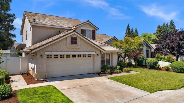 2162 Decatur Ave, Clovis, CA 93611 - view of front of property featuring concrete driveway, stucco siding, a garage, and a tiled roof
