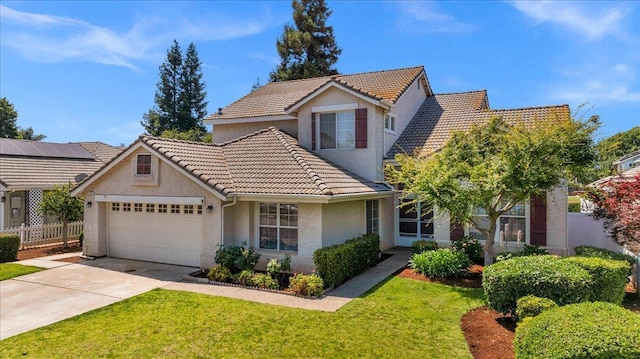2162 Decatur Ave, Clovis, CA 93611 - view of front facade with a tile roof, stucco siding, an attached garage, and driveway